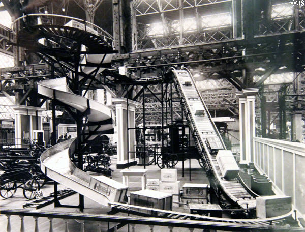 Print of Machinery Hall exhibit showing working conveyor system at Panama-Pacific International Exposition (1915) in private collection. San Francisco, CA.