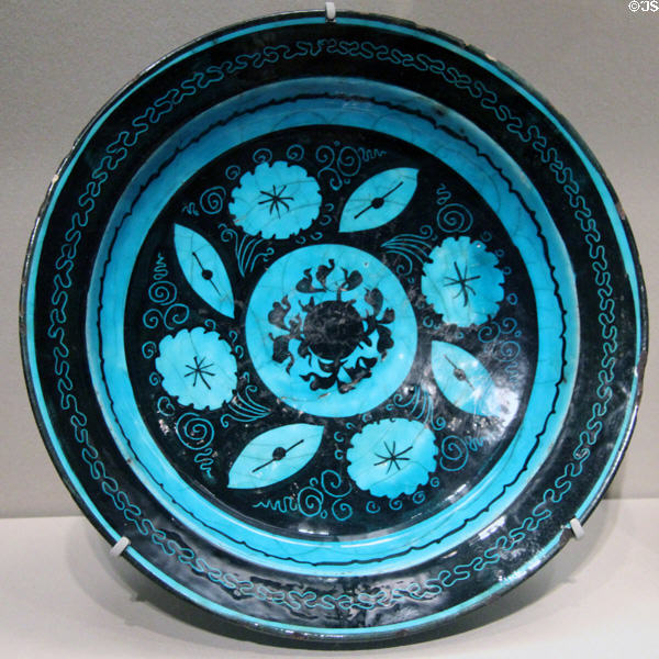 Earthenware fritware dish with flower & leaf designs (1450-1500) from Iran at Asian Art Museum. San Francisco, CA.
