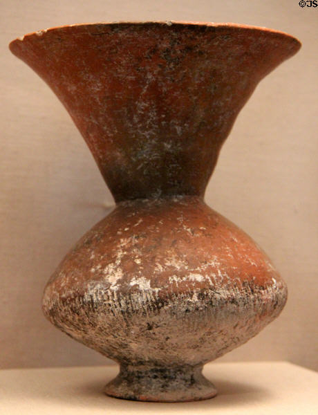 Earthenware footed jar with flaring neck (c1000-500 BCE) from Thailand at Asian Art Museum. San Francisco, CA.