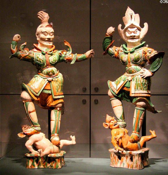 Glazed earthenware tomb guardians (618-906) from China at Asian Art Museum. San Francisco, CA.