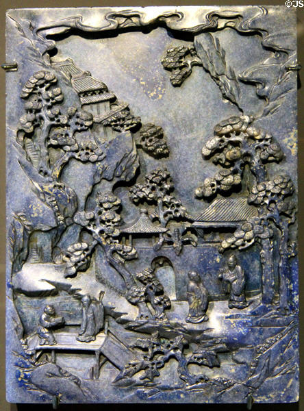 Carved dyed jade to imitate lapis lazuli of table screen showing gathering (1644-1911) from China at Asian Art Museum. San Francisco, CA.