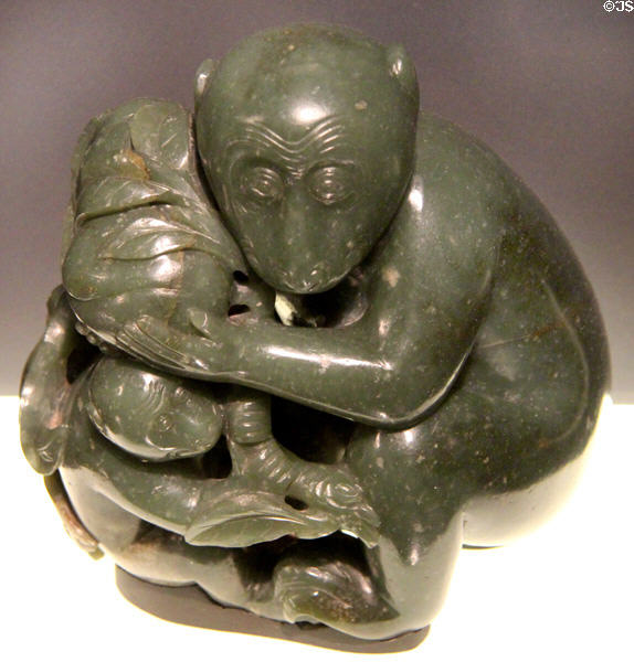 Carved Nephrite jade in shape of monkeys presenting peach of longevity (1644-1911) from China at Asian Art Museum. San Francisco, CA.