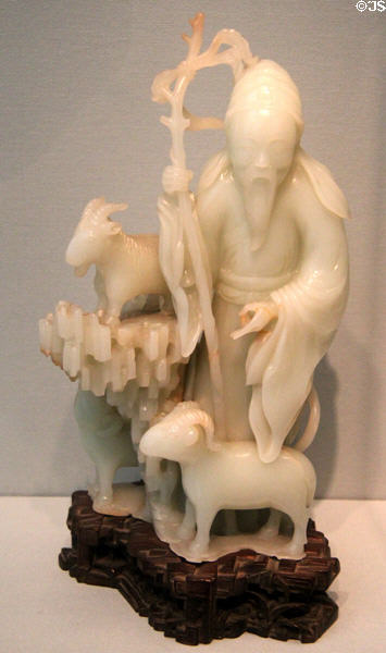 Carved Nephrite jade in shape of envoy Su Wu herding goats (c1800-1900) from China at Asian Art Museum. San Francisco, CA.