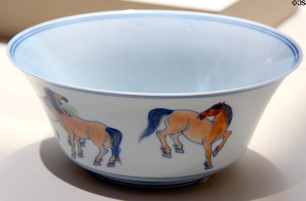 Porcelain bowl painted with horses (1662-1722) from China at Asian Art Museum. San Francisco, CA.