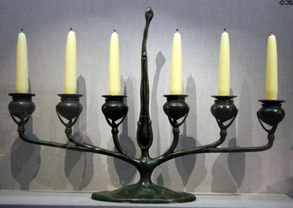 Six-candle bronze candelabra (c1900) by studio of Louis Comfort Tiffany at de Young Museum. San Francisco, CA.