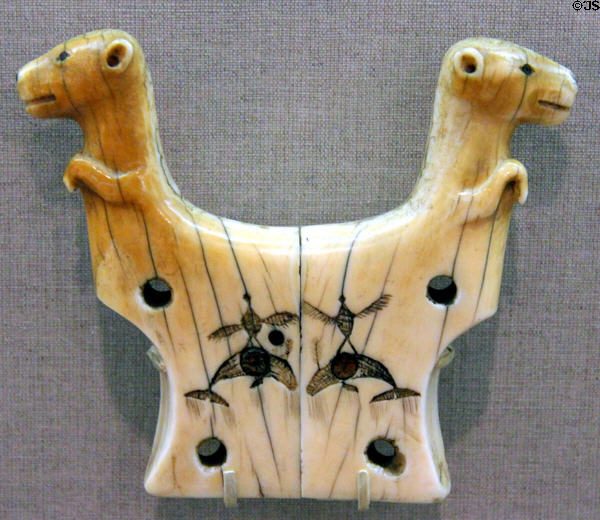 Inuit ivory harpoon rest with carved bears, thunderbirds & whales (19th-20thC) from Alaska at de Young Museum. San Francisco, CA.