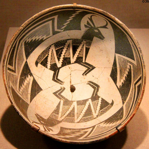 Mimbres native pottery bowl (c1010-1130) with opposing deer from southern New Mexico at de Young Museum. San Francisco, CA.