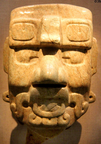 Maya carved stone head of Pax god (500 BCE-1 CE) from Mexico or Guatemala at de Young Museum. San Francisco, CA.