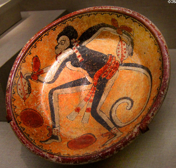 Maya earthenware plate with monkey & cacao pods (7th-10thC) from Mexico or Guatemala at de Young Museum. San Francisco, CA.