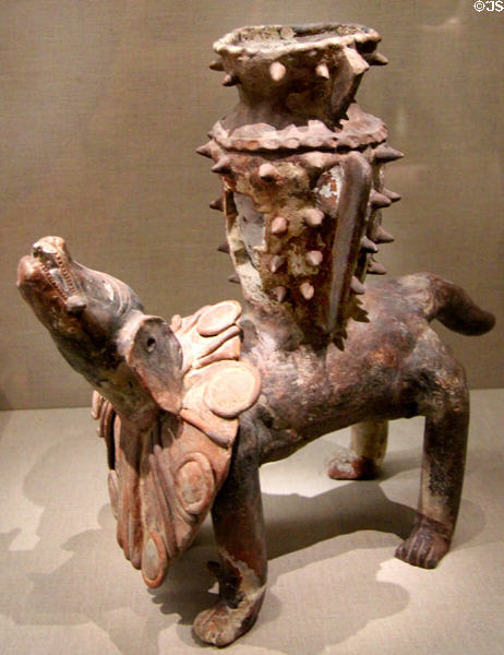 Maya earthenware vase or incense burner as dog carrying spike vessel (10th-13thC) from Guatemala at de Young Museum. San Francisco, CA.