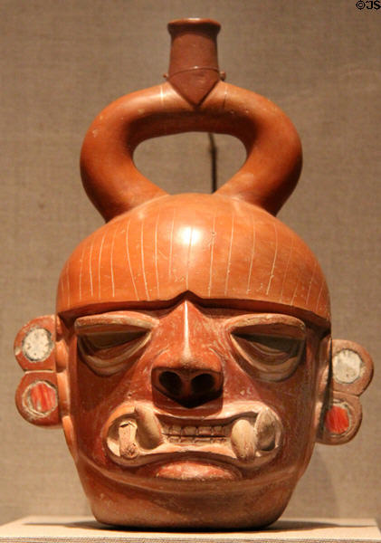Moche earthenware portrait vessel of fanged deity (400 BCE- 550 CE) from Peru at de Young Museum. San Francisco, CA.