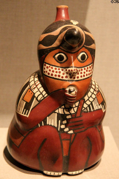 Nasca earthenware stirrup vessel in form of ceremonial figure (500-900) from Peru at de Young Museum. San Francisco, CA.