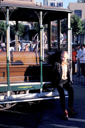 Cable car driver pushing car on turntable to reverse direction at Fishermans Wharf. San Francisco, CA.