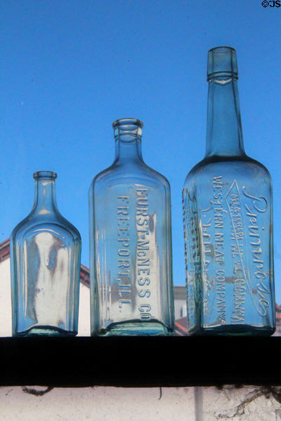 Antique clear glass bottles at Calaveras County Downtown Museum. San Andreas, CA.