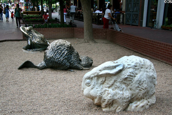 Frog, beaver & rabbit sculptures in children's play area on Pearl Street Mall. Boulder, CO.