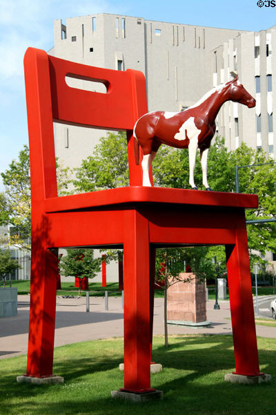 The Yearling by Donald Lipski, a life-sized horse on a super-sized chair at Denver Central Library. Denver, CO.