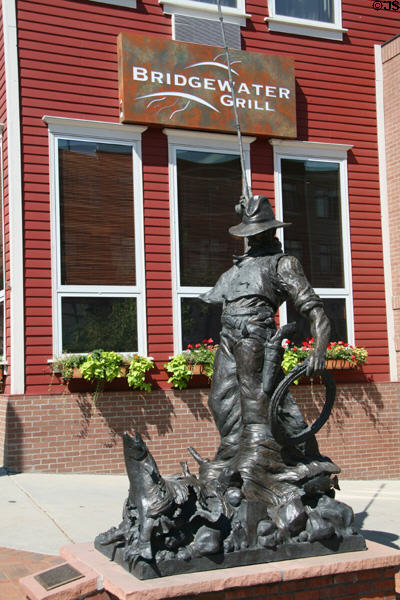 Cowboy's Day Off (2002) statue showing cowboy fishing by Michael Hamby. Golden, CO.