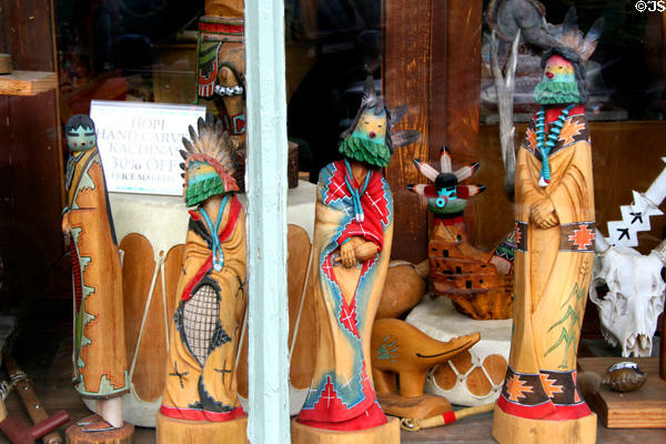 Hand carved Hopi Kachina dolls in shop window on Greene St. Silverton, CO.