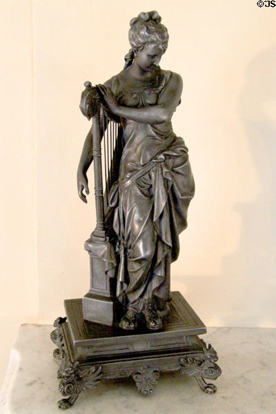 Statue of woman with harp at McAllister House Museum. Colorado Springs, CO.