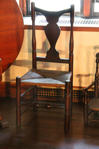 Fiddle back sidechair with rush seat (c1750) at Henry Whitfield State Museum. Guilford, CT.