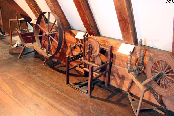 Collection of spinning wheels at Henry Whitfield State Museum. Guilford, CT.