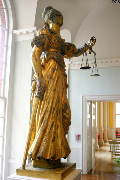 Original statue of justice with scales, blindfold & sword (1827) in Old State House after copy place on dome. Hartford, CT.