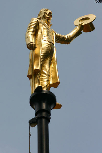 Man with top hat, one of series of gilded statues on poles surrounding Old State House. Hartford, CT.