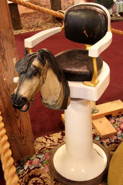 Carved horse head on child's barber chair at New England Carousel Museum. Bristol, CT.