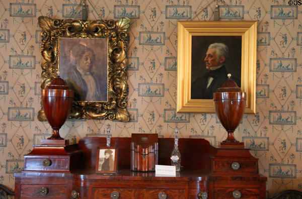 Family portraits over Empire-style sideboard (c1820) with knife boxes & urns in dining room at Hill-Stead Museum. Farmington, CT.
