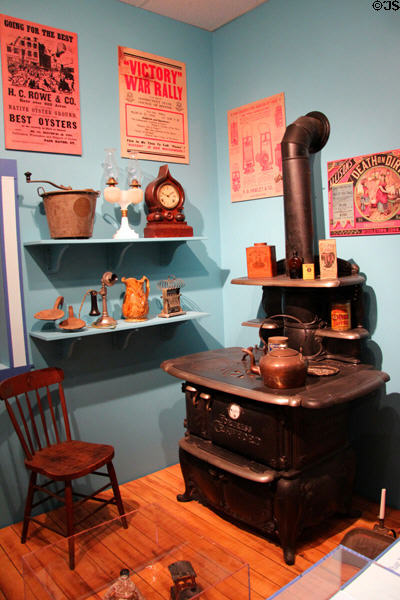 Display of late 1800s domestic items with cast-iron wood stove (1880s) by Walker & Pratt of Boston at Connecticut Historical Society. Hartford, CT.