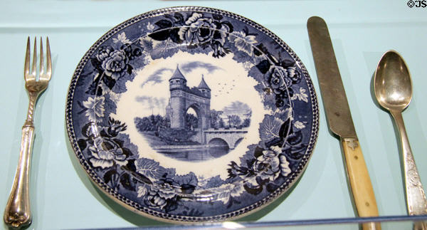 Transferware commemorative plate showing Hartford Civil War memorial (1896) by Josiah Wedgwood & Sons of Staffordshire, England flanked by CT-made silverware at Connecticut Historical Society. Hartford, CT.
