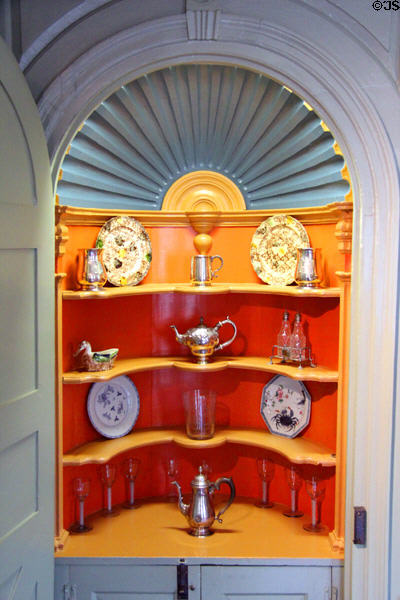 Corner cupboard with china, glass & silver in parlor at Joseph Webb House. Wethersfield, CT.