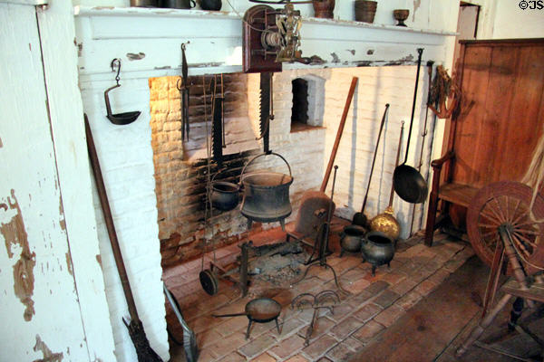 Cooking fireplace with utensils & settle at Buttolph-Williams House. Wethersfield, CT.
