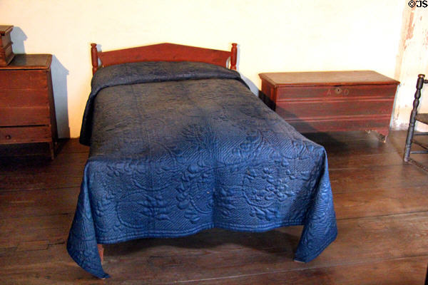 Glazed wool calamanco quilt in dark blue (c1775-1825) with shine added using pumice stone at Buttolph-Williams House. Wethersfield, CT.