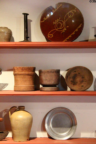 Pantry with redware, wood mortars, stoneware & pewter at Thankful Arnold House. Haddam, CT.