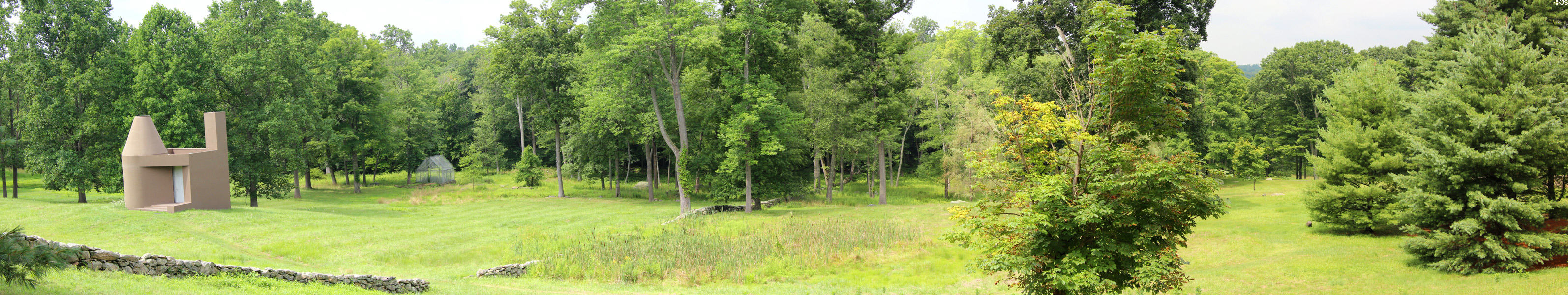 Panorama of stone walls & tree gaps which Johnson considered part of landscape design at Philip Johnson Glass House. New Canaan, CT.