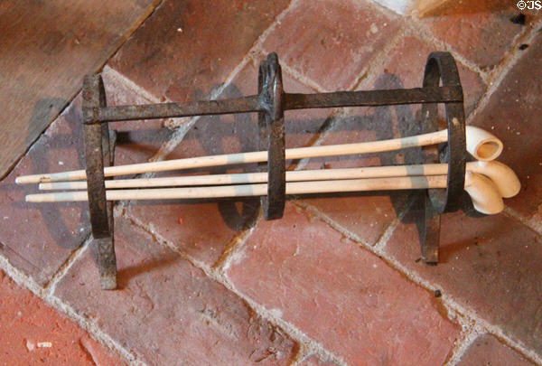 Rack for cleaning clay pipes by heating them in fireplace at Nathaniel Hempstead House. New London, CT.