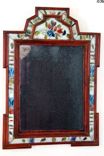 Early American mirror with painted glass on frame at Nathaniel Hempstead House. New London, CT.