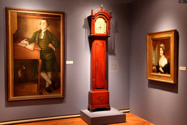 Gallery with portraits & tall clock by Erastus Tracy at Lyman Allyn Art Museum. New London, CT.