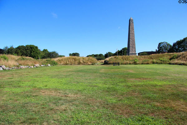 Fort Griswold remains with Monument (1830) beyond which honors American Patriots massacred (Sept. 6, 1781) by British troops under Benedict Arnold. Groton, CT.