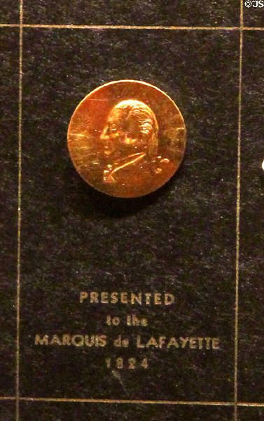 Gold button embossed with image of George Washington (1824) made in Waterbury, CT presented to Lafayette at Mattatuck Museum. Waterbury, CT.