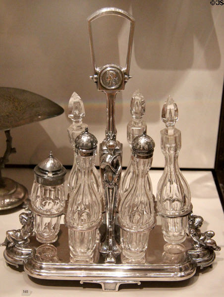 Silverplated caster frame & 6 bottles (1875-95) by Simpson, Hall, Miller & Co. of Wallingford, CT at Yale University Art Gallery. New Haven, CT.