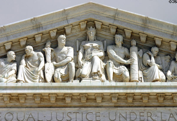 Pediment of sculpted justice flanked by the might of soldiers & wise men on Supreme Court. Washington, DC.