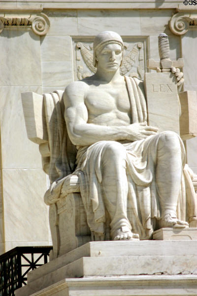 Sculpture of seated man holding sword & LEX tablet in front of Supreme Court building. Washington, DC.