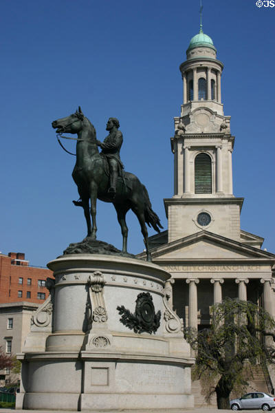 Equestrian statue of Civil War General Thomas in front of steeple of National City Christian Church. Washington, DC.
