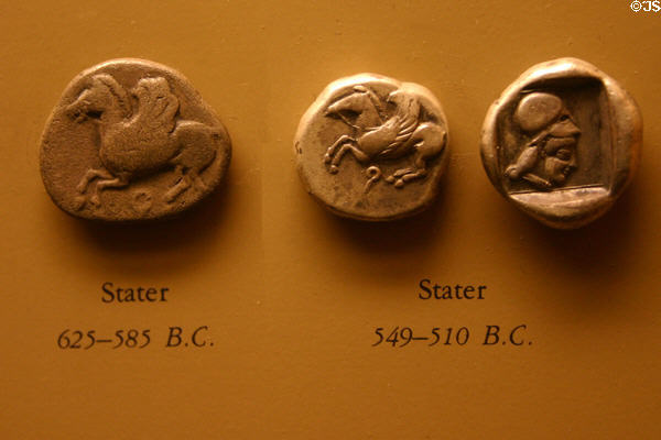 Greek Stater coins (625-510 B.C.) showing flying horses in American History Museum. Washington, DC.