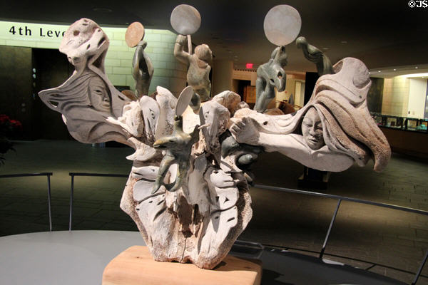 Memories: An Ancient Past whale skull sculpture (2010) shows drum dancers & spirits by Abraham Anghik Ruben at National Museum of the American Indian. Washington, DC.