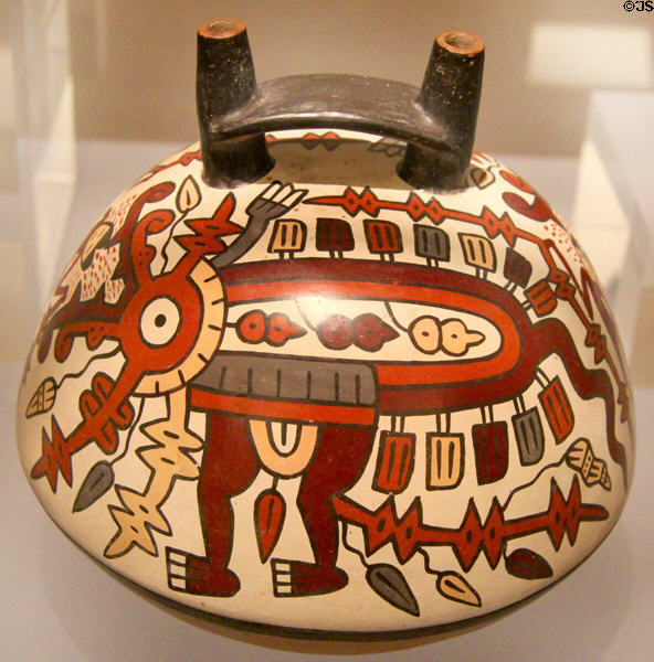 Nazca ceramic double-spout-&-bridge bottle painted with fearsome creature (350-450) from Peru at Dumbarton Oaks Museum. Washington, DC.
