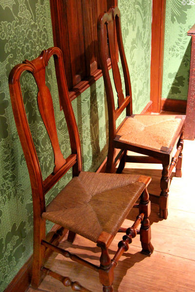 Side chairs with rush seats (1730-1800) from New England in Massachusetts Period Room at DAR Memorial Continental Hall. Washington, DC.