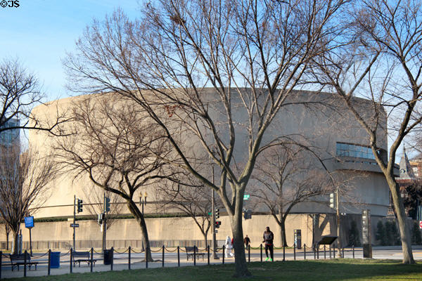 Hirshhorn Museum through trees of National Mall is a Smithsonian Museum. Washington, DC.